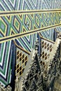 Fragment of a multi-colored mosaic roof with Gothic details and small dormers Royalty Free Stock Photo
