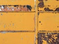 A section of a rusty metal shipping container used for storage at a railroad yard