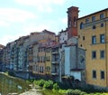 Section of the south bank of the Arno in Florence with old colourful houses facing the river