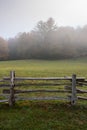 Section of Split Rail Fence and Foggy Field Royalty Free Stock Photo