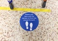 Major UK supermarket. Health and Safety floor markers.