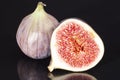 Sectioned fruit figs isolated on black background