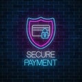 Secure payment glowing neon sign. Payment protection symbol with shield and credit card with lock Royalty Free Stock Photo