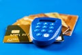 Secure wireless payment concept. Gold credit cards and security remote Royalty Free Stock Photo