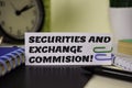 Securities and Exchange Commision! on the paper isolated on it desk. Business and inspiration concept