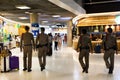 Security airport policemen guard walking monitor watch out for service passengers travelers and thai people visit travel at