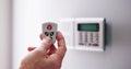 Security Alarm Keypad With Person Arming The System Royalty Free Stock Photo