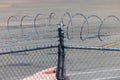 Security barbed wire on airport perimeter fence Royalty Free Stock Photo