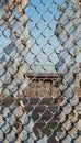 Security breach a cut out section in a chain link fence symbolizing vulnerability and boundaries Royalty Free Stock Photo