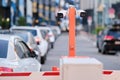 A security camera and a barrier at the entrance to the courtyard of residential houses. CCTV in a private parking lot in front of