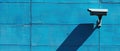 Security Camera on Blue Wall Royalty Free Stock Photo