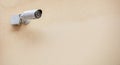 Security Camera CCTV isolated on beige color wall background Royalty Free Stock Photo