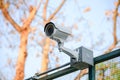 Security Camera CCTV over fence blue sky Royalty Free Stock Photo