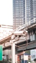 Security camera equipment on pole in evening traffic light with flare light effect and copyspace Royalty Free Stock Photo