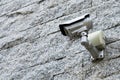 Security Camera on a grey stone wall