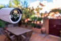 Security camera installed in the garden of a house for the surveillance of the entrance door to the house Royalty Free Stock Photo