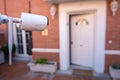 Security camera installed in the garden of a house for the surveillance of the entrance door to the house Royalty Free Stock Photo