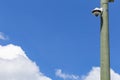 Security camera and urban video in front of blue sky. Outdoor cctv video surveillance cameras. Safety system area control outdoor Royalty Free Stock Photo