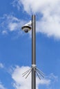 Security camera and urban video in front of blue sky. Outdoor cctv video surveillance cameras. Safety system area control outdoor Royalty Free Stock Photo