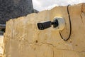 Security Camera Mounted on Weathered Stone Wall Royalty Free Stock Photo