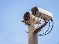 Security camera over blue sky Royalty Free Stock Photo