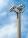 Security camera over blue sky Royalty Free Stock Photo