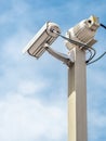 Security camera over blue sky Royalty Free Stock Photo