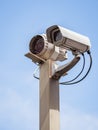 Security camera over blue sky Royalty Free Stock Photo
