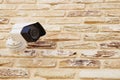 Security camera over brick wall Royalty Free Stock Photo