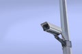 Security camera on a post over clear sky background Royalty Free Stock Photo