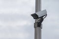Security camera on a post over clear sky background Royalty Free Stock Photo