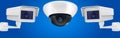 Security camera set. Wall and ceiling mount CCTV surveillance system on blue background Royalty Free Stock Photo