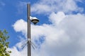 Security camera and urban video in front of blue sky. Outdoor cctv video surveillance cameras. Safety system area control outdoor Royalty Free Stock Photo