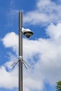 Security camera and urban video in front of blue sky. Outdoor cctv video surveillance cameras. Safety system area control outdoor Royalty Free Stock Photo