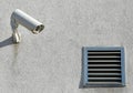 Security camera on the wall next to a ventage Royalty Free Stock Photo