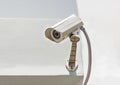 Security camera on the white wall. Royalty Free Stock Photo