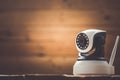 Security camera on Wood table. IP Camera Royalty Free Stock Photo