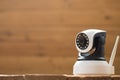 Security camera on Wood table. IP Camera Royalty Free Stock Photo