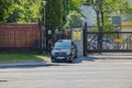 Security car in front of entrance to Russian Embassy metal fence. Stockholm, Royalty Free Stock Photo