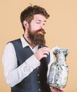 Security and cash money savings. Banking concept. Man bearded guy hold jar full of cash savings. Establish your budget Royalty Free Stock Photo