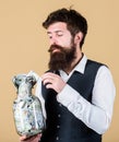 Security and cash money savings. Banking concept. Man bearded guy hold jar full of cash savings. Establish your budget Royalty Free Stock Photo