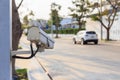 Security CCTV camera operating over the road Royalty Free Stock Photo