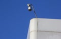 CCTV camera overlooking a building Royalty Free Stock Photo