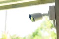 Security CCTV camera surveillance system outdoor of house. A blurred night city scape background. Modern CCTV camera on a wall. Royalty Free Stock Photo
