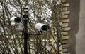 Security CCTV Cameras on a lamp post in the park Royalty Free Stock Photo