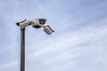 Security CCTV cameras on a pylon in the sky background Royalty Free Stock Photo