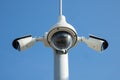 Security cctv cameras on pylon. Surveillance cameras for privacy and protection on blue background Royalty Free Stock Photo