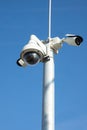 Security cctv cameras on pylon. Surveillance cameras for privacy and protection on blue background Royalty Free Stock Photo