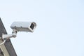 Security cctv surveillance camera in front of blue sky with copy Royalty Free Stock Photo