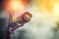 Security cctv surveillance camera on outdoor pole in dark cloud Royalty Free Stock Photo